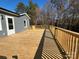 Spacious back porch with an open rail, wooden stairs and room to enjoy the outdoors at 3596 Bethany Church Rd, Claremont, NC 28610