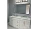 Bathroom vanity with double sinks, ample counter space, and updated lighting at 3596 Bethany Church Rd, Claremont, NC 28610