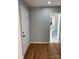 Bathroom with pedestal sink and hardwood floors at 3596 Bethany Church Rd, Claremont, NC 28610
