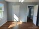 Bedroom featuring wood flooring, closet and doorway at 3596 Bethany Church Rd, Claremont, NC 28610