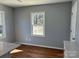 Dining area features two windows and hardwood floors at 3596 Bethany Church Rd, Claremont, NC 28610