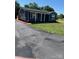 Single-story house with a covered porch, a long driveway, a green lawn, and fresh landscaping at 3596 Bethany Church Rd, Claremont, NC 28610