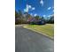 Front view of home with long driveway, fresh landscaping, and new windows and siding at 3596 Bethany Church Rd, Claremont, NC 28610