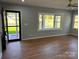 Bright living room with wood floors, neutral walls, bay window, and lots of natural light at 3596 Bethany Church Rd, Claremont, NC 28610