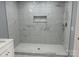 Shower featuring marble tile surround with shower head and handheld sprayer at 3596 Bethany Church Rd, Claremont, NC 28610