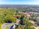 Aerial view of home, surrounded by mature trees, neighboring church and construction at 5320 Liberty Hill W Rd, York, SC 29745