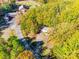 Aerial view of home, surrounded by mature trees and neighboring church at 5320 Liberty Hill W Rd, York, SC 29745
