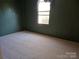 Bedroom showcasing neutral carpeted flooring and dark green walls at 5320 Liberty Hill W Rd, York, SC 29745