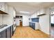 View of the kitchen with white cabinets and laminate flooring throughout at 5320 Liberty Hill W Rd, York, SC 29745