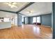 Open-concept living room showcasing laminate flooring with adjacent kitchen and dining areas at 5320 Liberty Hill W Rd, York, SC 29745