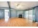 Bright living room featuring fireplace and access to outdoor deck through sliding glass door at 5320 Liberty Hill W Rd, York, SC 29745