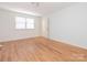 Bright bedroom with hardwood floors, large window and lots of natural light at 1209 Moretz Ave, Charlotte, NC 28206