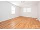 Sunlit bedroom with hardwood floors and two windows at 1209 Moretz Ave, Charlotte, NC 28206