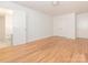 Large bedroom with hardwood floors, white walls, and access to an ensuite bathroom at 1209 Moretz Ave, Charlotte, NC 28206