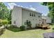 Spacious backyard featuring a deck, fence, and lush green lawn, perfect for outdoor entertaining at 14027 Grand Traverse Dr, Charlotte, NC 28278