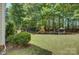 A spacious backyard featuring a playset and seating area, perfect for outdoor activities and relaxation at 14027 Grand Traverse Dr, Charlotte, NC 28278