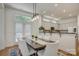 Charming dining area featuring a dining table with seating for six, light fixture, and kitchen view at 14027 Grand Traverse Dr, Charlotte, NC 28278