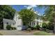 Beautiful home with a two-story porch, well-maintained landscaping, and a driveway with a basketball hoop at 14027 Grand Traverse Dr, Charlotte, NC 28278