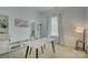 Clean office space featuring a marble-look desk, neutral walls and carpet, built-in shelving, and a window at 14027 Grand Traverse Dr, Charlotte, NC 28278