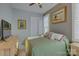 Bright bedroom with a green comforter and wood dresser at 14535 Crosswater Ln, Charlotte, NC 28278