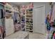 Large walk-in closet with ample shelving and drawers at 14535 Crosswater Ln, Charlotte, NC 28278