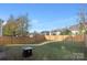 Large fenced backyard with fire pit at 5723 Wallace Cabin Dr, Charlotte, NC 28212