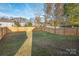 Fenced backyard with grassy lawn at 5723 Wallace Cabin Dr, Charlotte, NC 28212