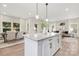 Open concept kitchen with large island and granite countertops at 5723 Wallace Cabin Dr, Charlotte, NC 28212