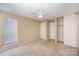 Bedroom with double closets and window at 7141 Stonington Ln, Charlotte, NC 28227