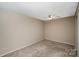 Well-lit bedroom featuring a ceiling fan and neutral decor at 7141 Stonington Ln, Charlotte, NC 28227