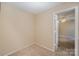 Small bedroom with door to another room at 7141 Stonington Ln, Charlotte, NC 28227