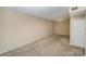 Spacious carpeted bedroom with ceiling fan and closet at 7141 Stonington Ln, Charlotte, NC 28227