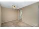 Bright dining room with ceiling fan and kitchen access at 7141 Stonington Ln, Charlotte, NC 28227