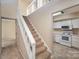 Open entryway with view of kitchen and staircase at 7141 Stonington Ln, Charlotte, NC 28227