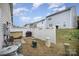 Private backyard with patio, grill, and small fenced area at 14423 Glendon Hall Ln, Charlotte, NC 28262