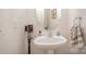 Clean and updated half bathroom with pedestal sink at 14423 Glendon Hall Ln, Charlotte, NC 28262