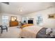 Spacious bedroom with desk, dresser and large windows at 14423 Glendon Hall Ln, Charlotte, NC 28262