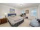 Cozy bedroom with ample natural light and a desk area at 14423 Glendon Hall Ln, Charlotte, NC 28262
