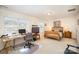 Bright bedroom with a bed, desk, and plenty of natural light at 14423 Glendon Hall Ln, Charlotte, NC 28262