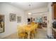 Open dining area with light wood table and chairs, adjacent to kitchen at 14423 Glendon Hall Ln, Charlotte, NC 28262