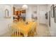 Bright dining area with view into kitchen and living room at 14423 Glendon Hall Ln, Charlotte, NC 28262