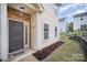 Townhome's front entrance with landscaping at 14423 Glendon Hall Ln, Charlotte, NC 28262