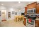Well-equipped kitchen with stainless steel appliances and wood cabinets at 14423 Glendon Hall Ln, Charlotte, NC 28262