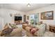Cozy living room with sliding glass doors leading to a private patio at 14423 Glendon Hall Ln, Charlotte, NC 28262