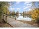 Scenic pond with footbridge and fountain at 14423 Glendon Hall Ln, Charlotte, NC 28262