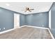 Spacious bedroom with blue walls and hardwood floors at 2668 Polo Ln, Maiden, NC 28650