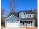 Two-story house with blue siding, white trim, and a two-car garage at 2668 Polo Ln, Maiden, NC 28650