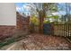 Small backyard with brick wall and gate at 2705 North Center St # 74, Hickory, NC 28601