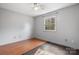 Simple bedroom featuring hardwood floors and a window at 2705 North Center St # 74, Hickory, NC 28601