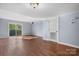 Spacious living area featuring hardwood floors and a sliding glass door at 2705 North Center St # 74, Hickory, NC 28601